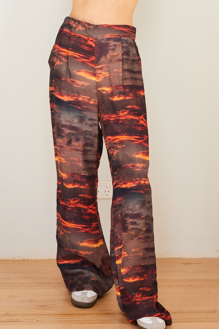 Printed silk pants with a sunset on them.